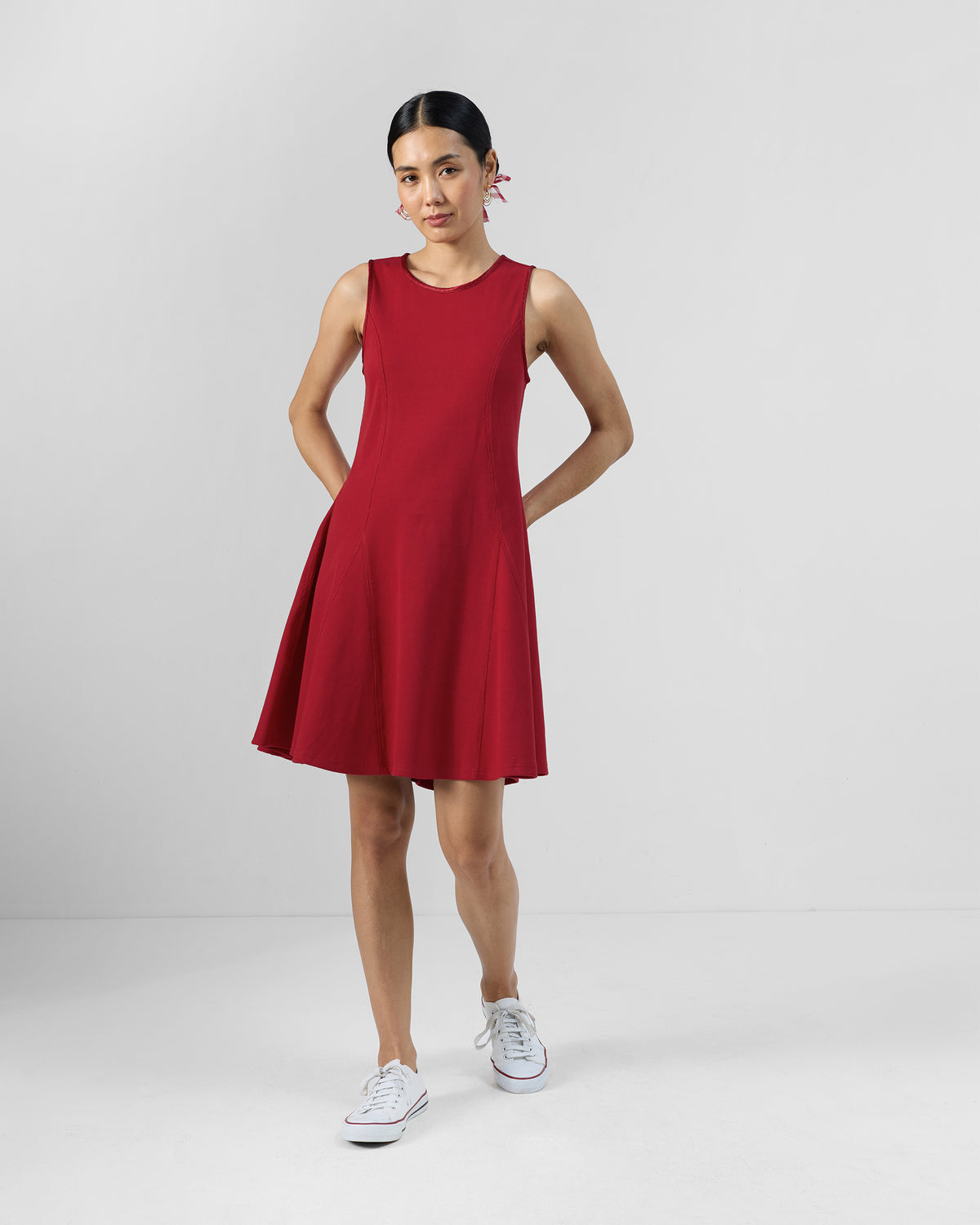 Person wearing a red Norva skater dress.