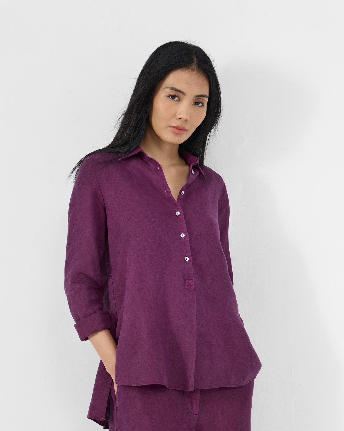 Plum Mati linen shirt with a pointed collar and half button placket.