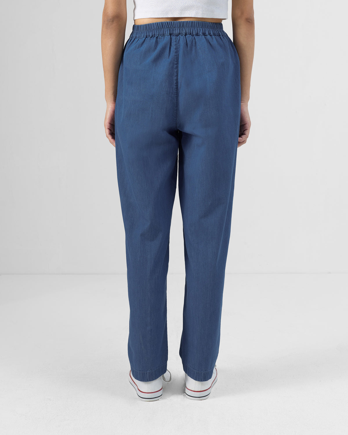 Back of blue Kaiteki Pants with a gathered elastic waistband.
