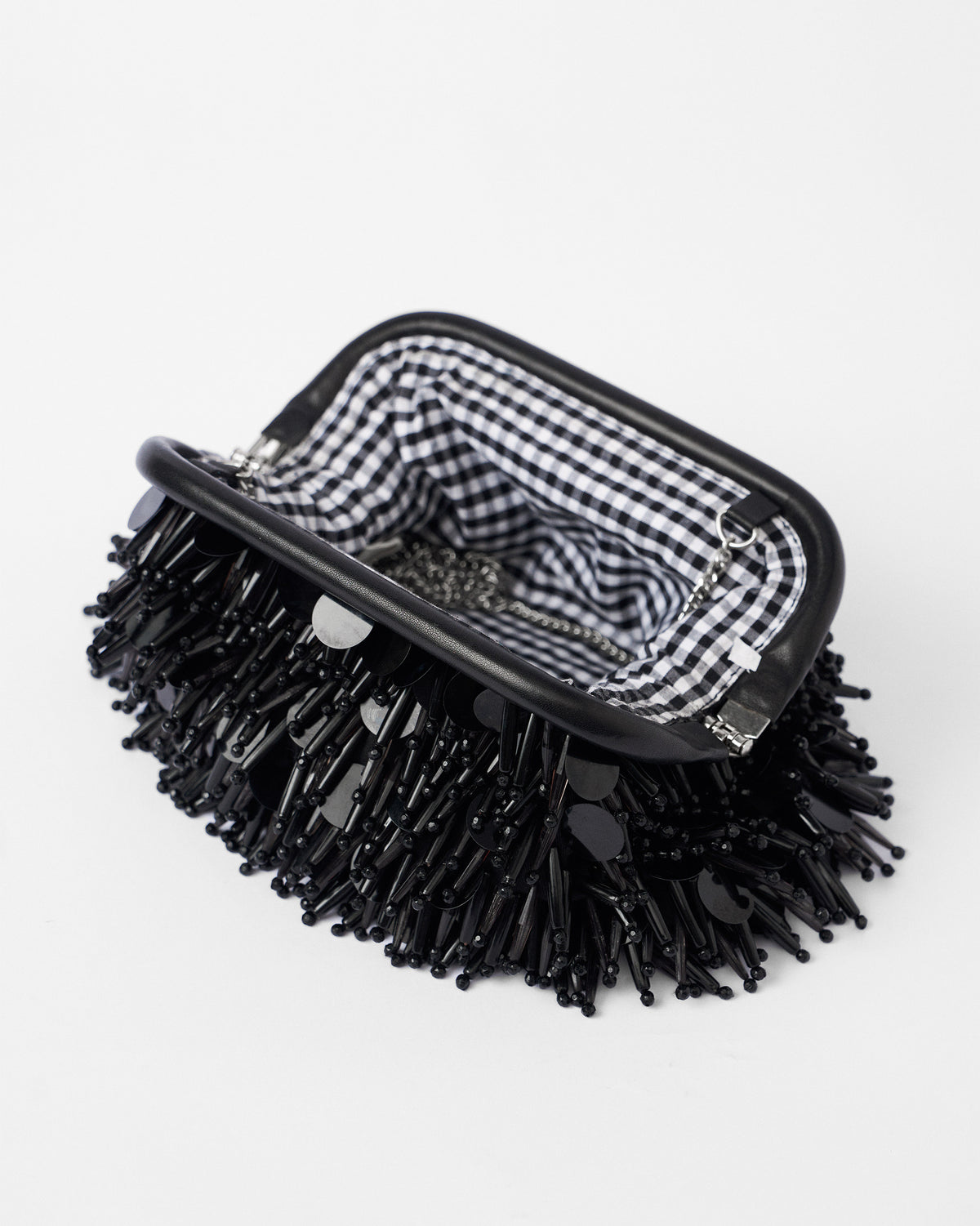 Open black Starry Night Clutch with gingham lining and a silver chain.
