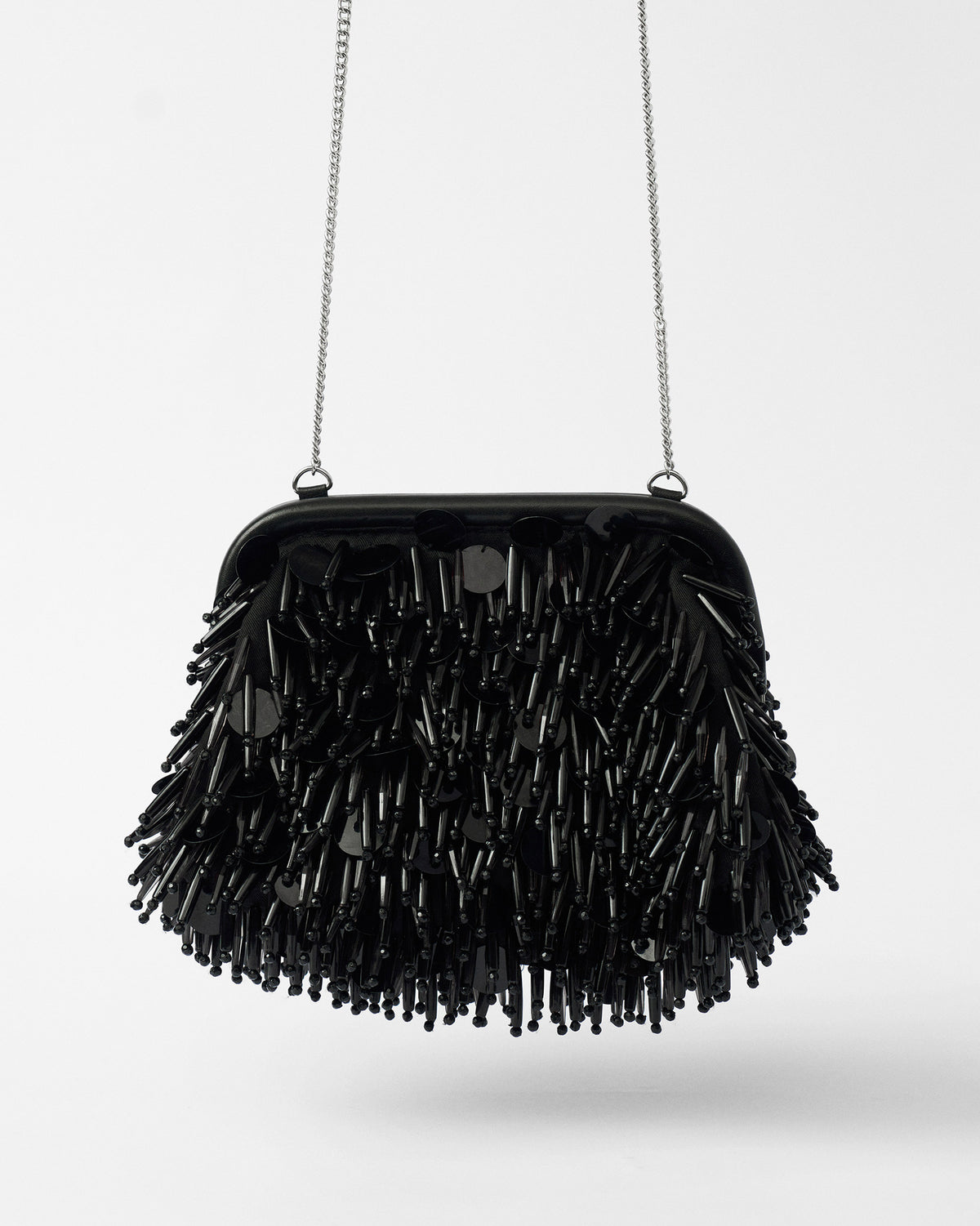 Black Starry Night Clutch hanging from a fine silver chain strap.