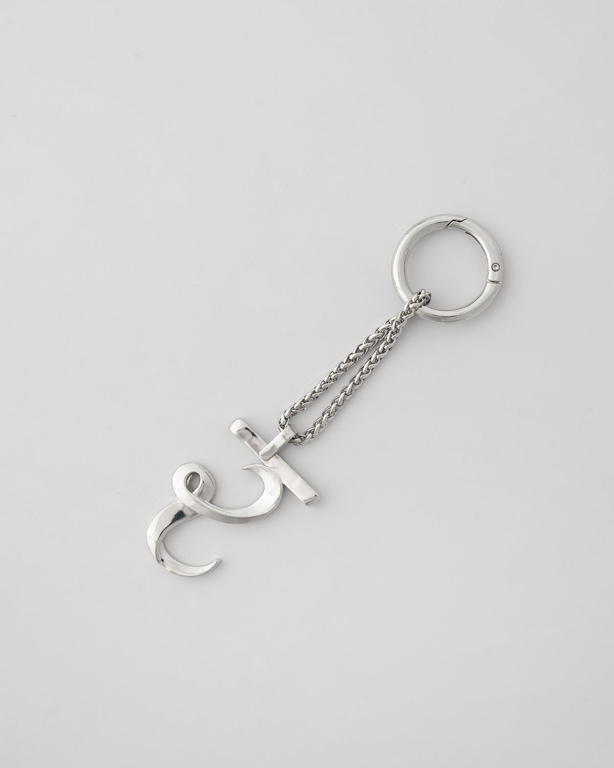 Alphabet R Bag Charm in silver, with chain and clasp ring on a light background.
