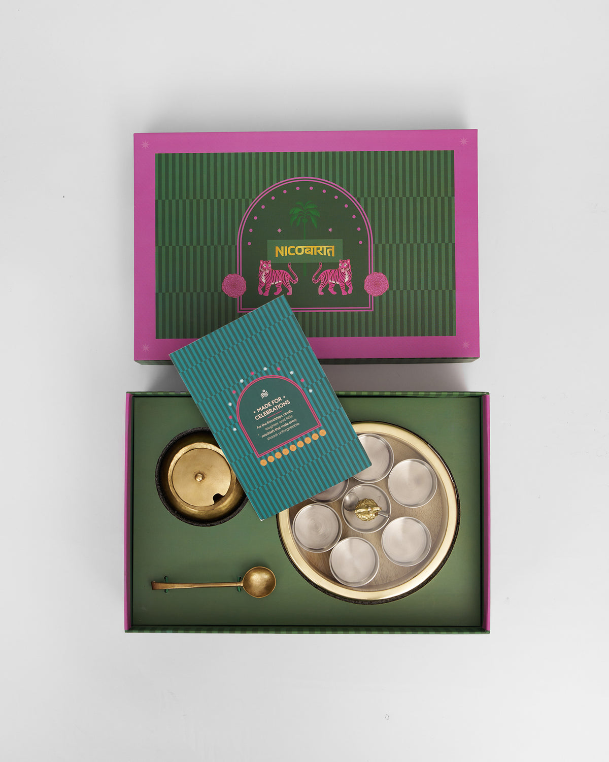 Open Chand Madhu gift box showing spice cups, brass pot, and card.