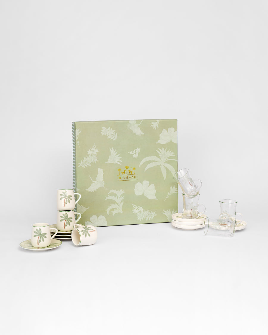 The cups and saucers in front of the sage gift box
