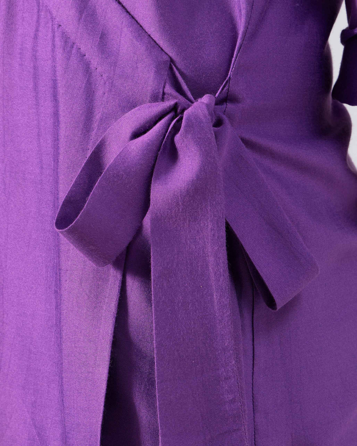 Close-up of the waist tie on a purple Katya wrap shirt.