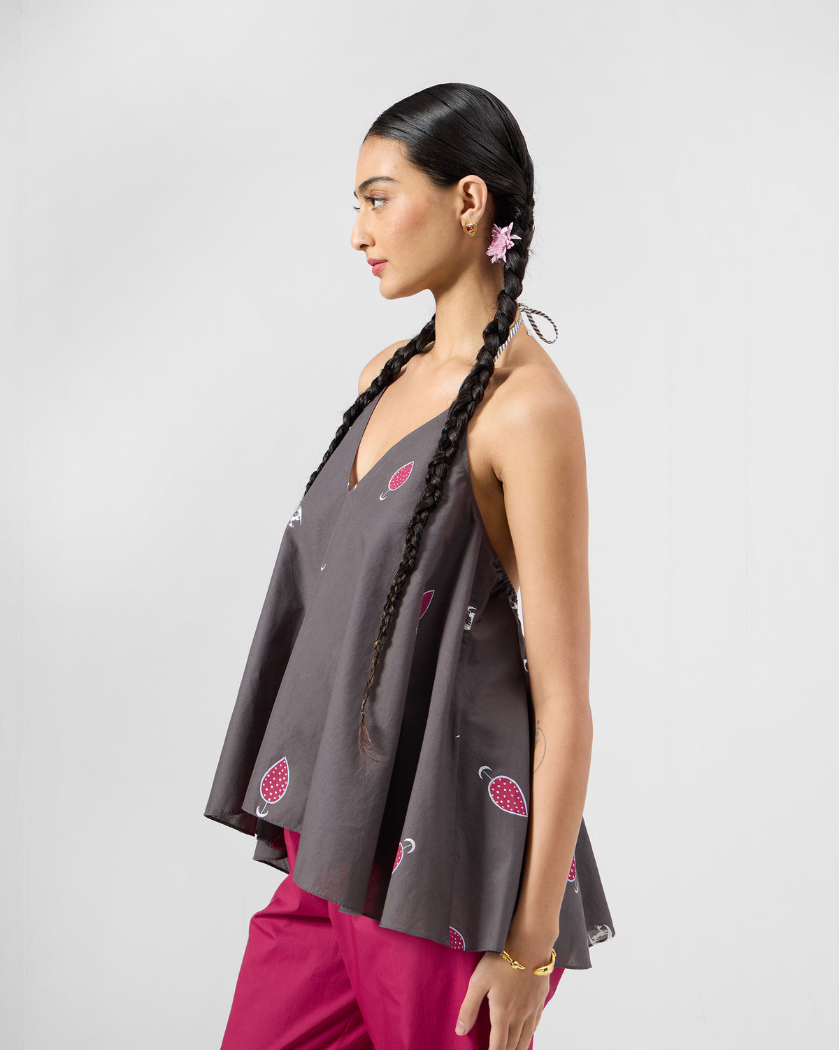 Side view of a charcoal Daman top showing the A-line flare.