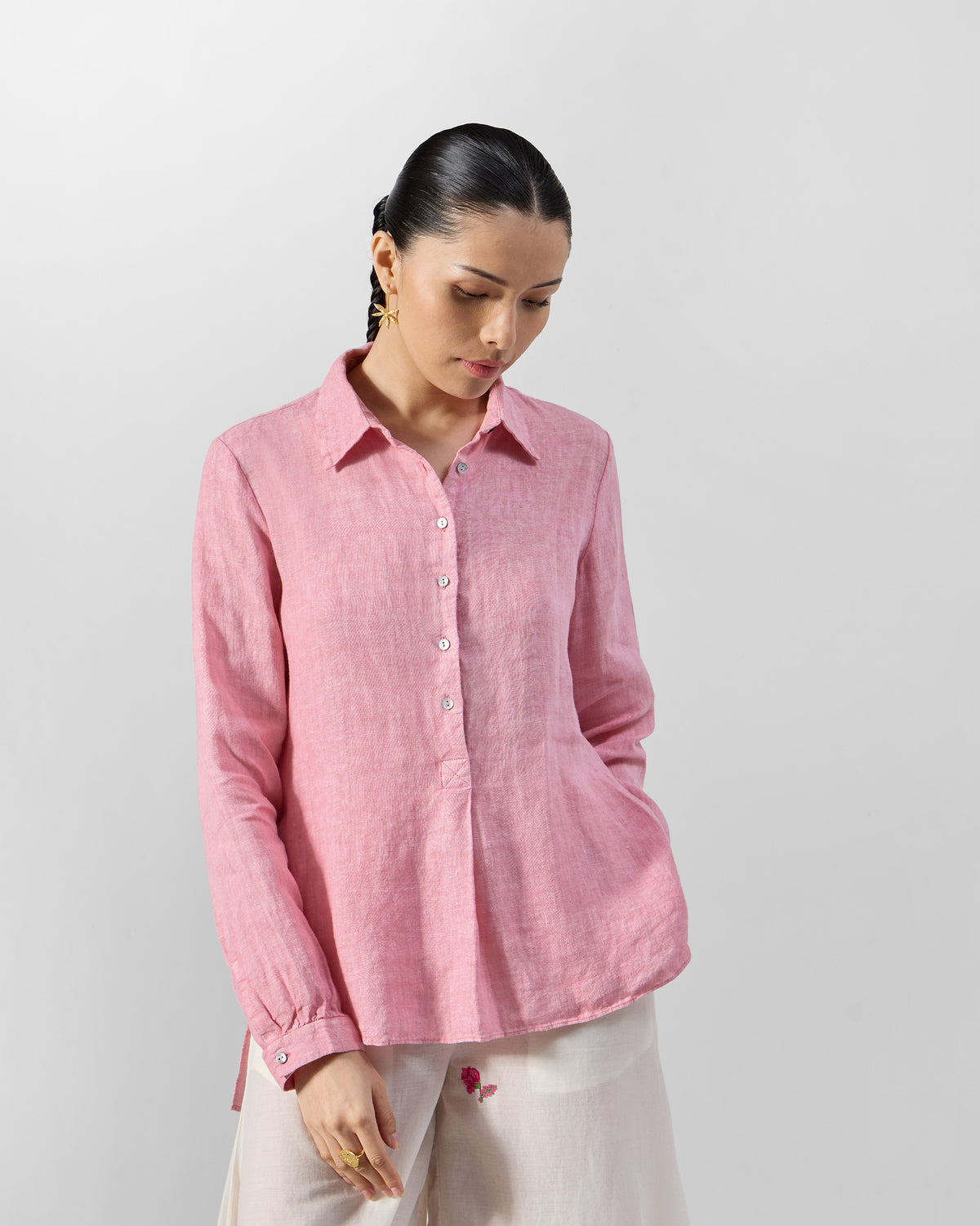 Soft pink Mati linen shirt with a pointed collar and half button placket.