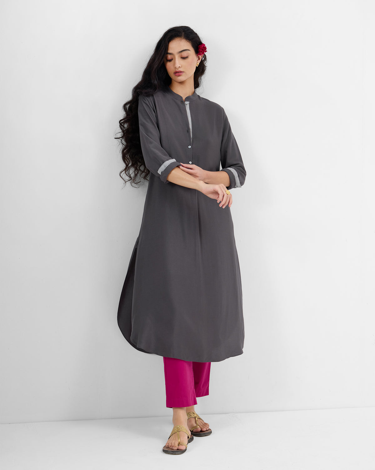 Person wearing a charcoal silk-blend long kurta with mandarin collar and buttoned half-placket.
