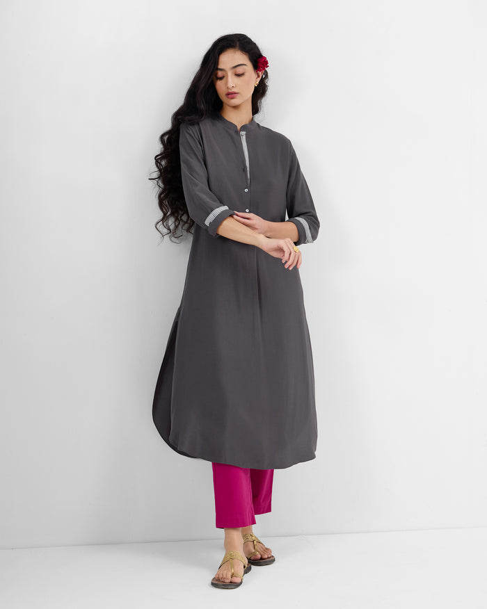 Person wearing a charcoal silk-blend long kurta with mandarin collar and buttoned half-placket.