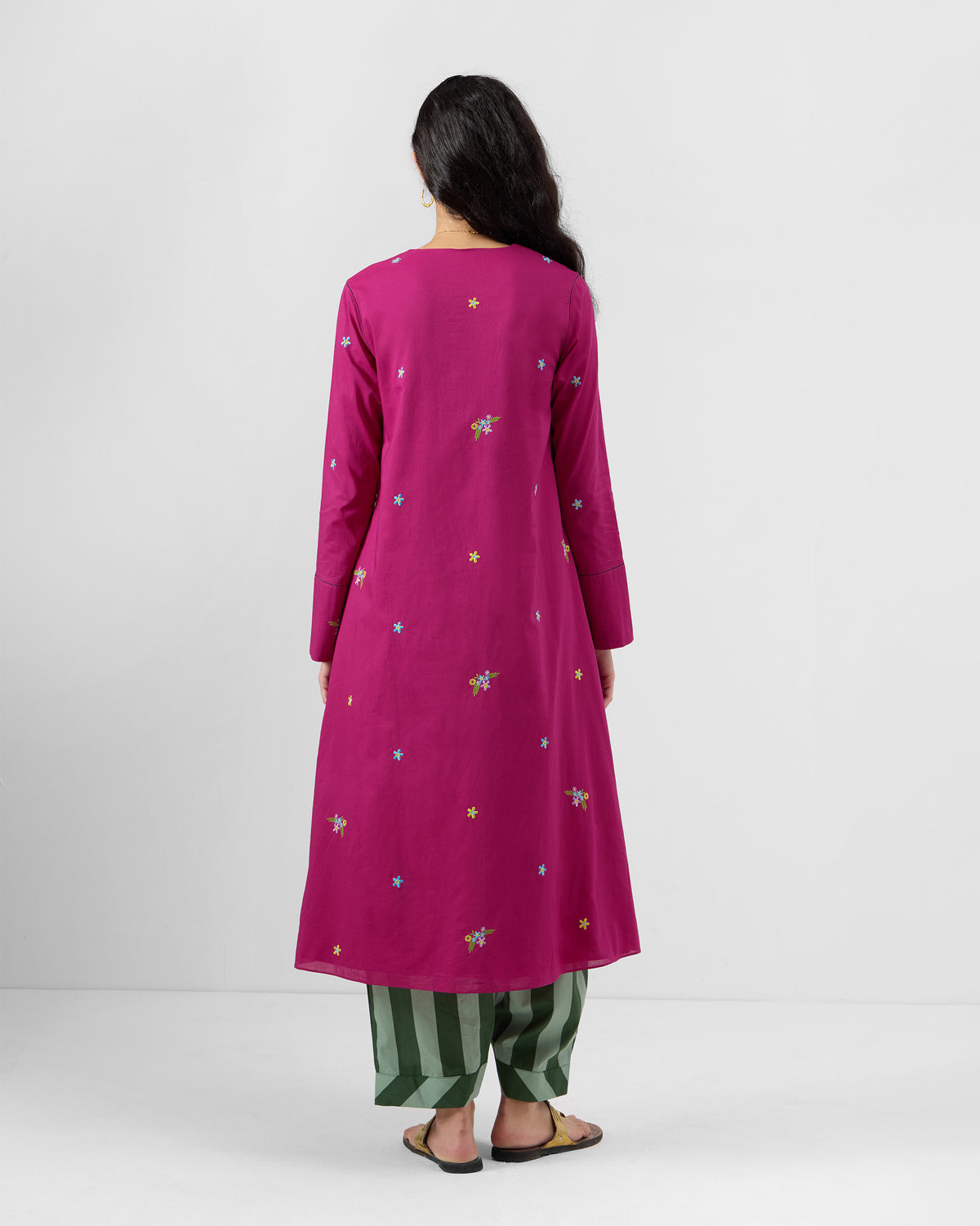 Back of a berry pink Narsa kurta with star and floral embroidery.