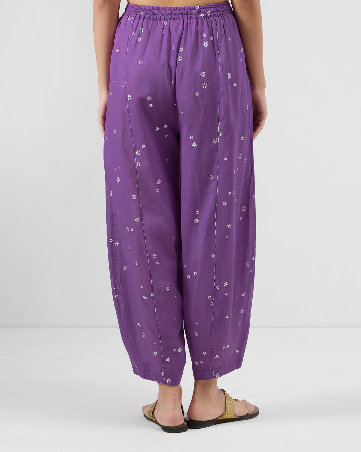 Back of purple floral Bora pants with a gathered elastic waistband.
