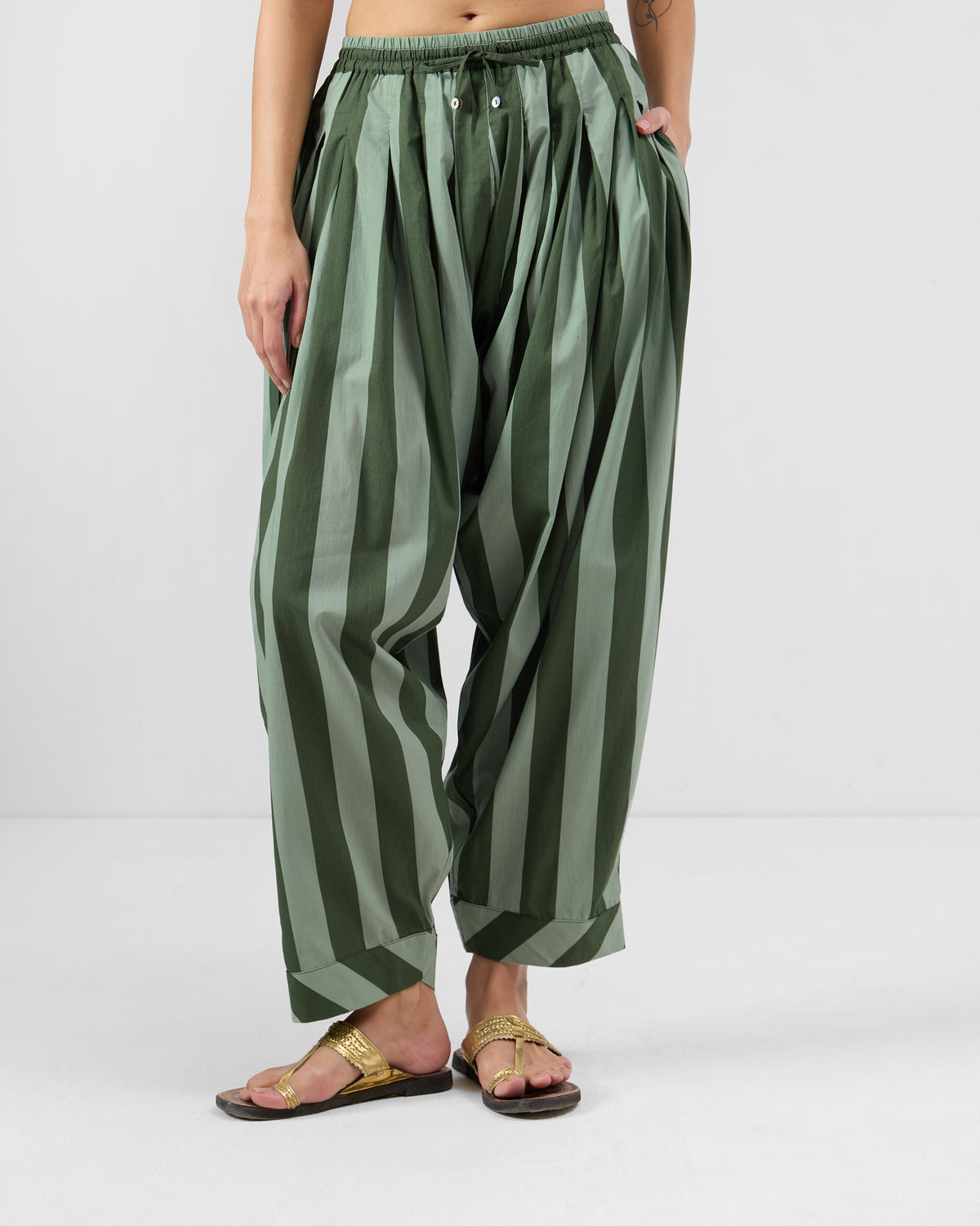 Person wearing dark green and olive striped Salem pants.