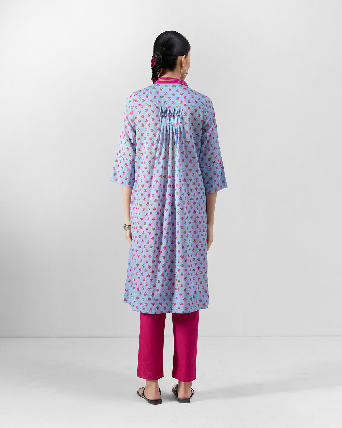 Back of an ice blue floral Kovvur Kurta with gathered back pleats.