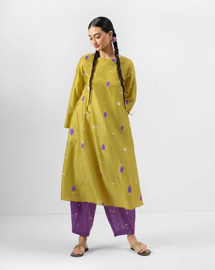 Person wearing a chartreuse Boat Neck Kurta with purple embroidered motifs.
