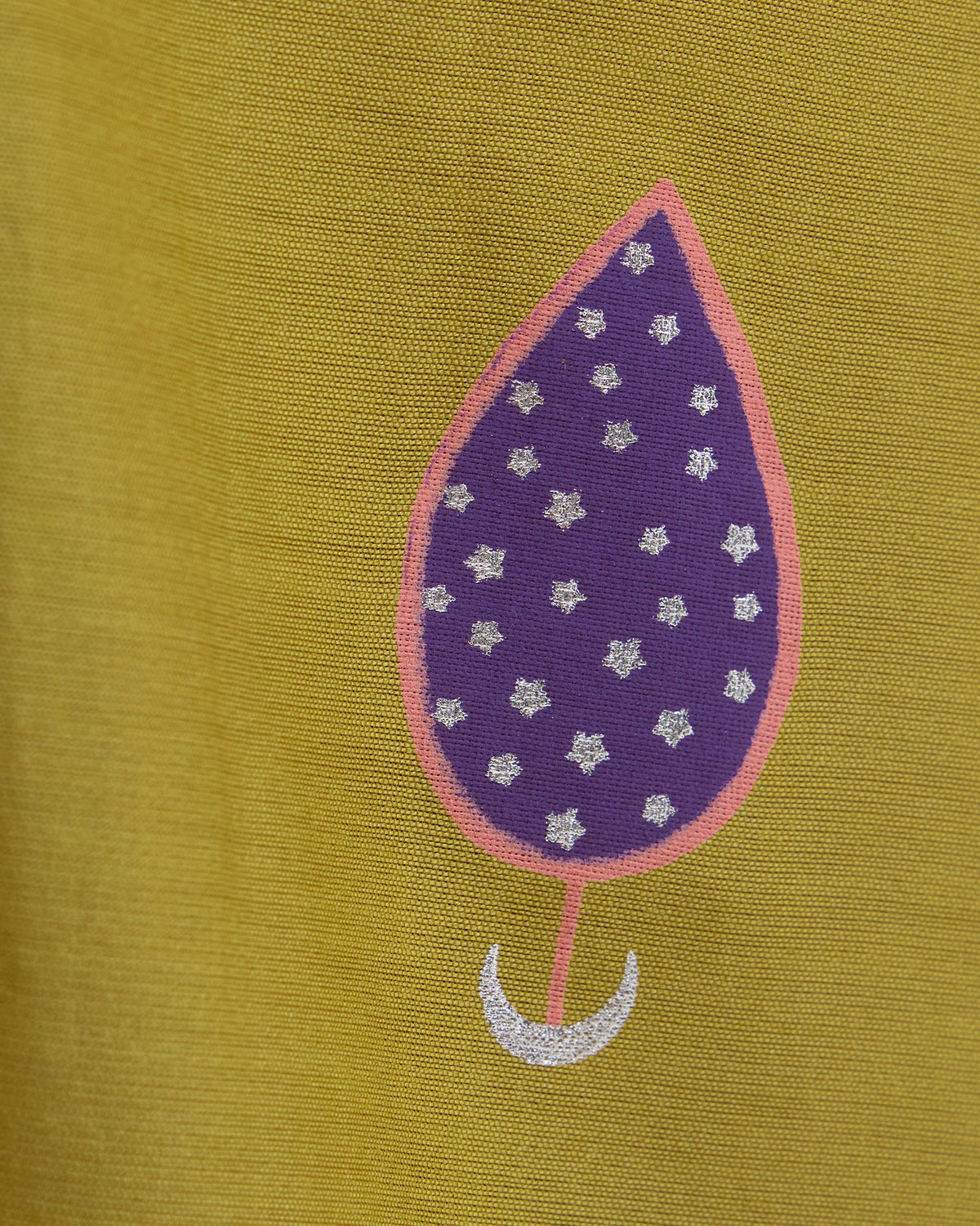Close-up of a purple star-filled motif on a chartreuse Boat Neck Kurta.