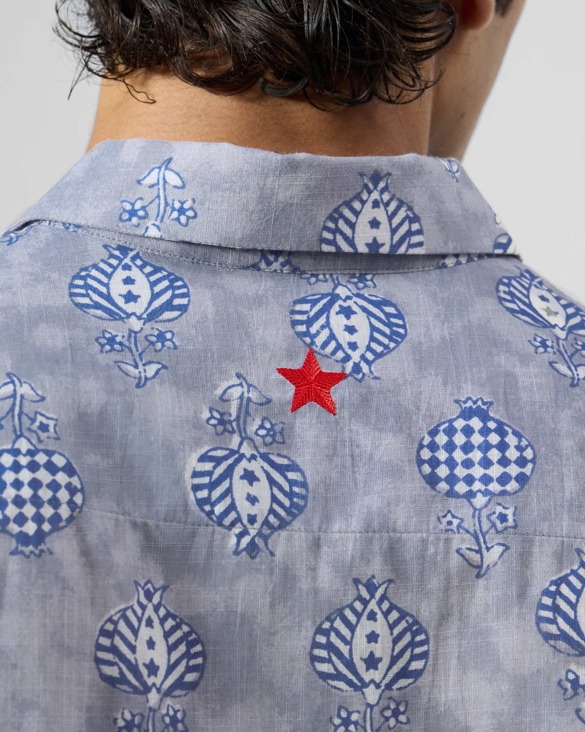 Close-up of the red star on the back of a block-printed Ganga Shirt.