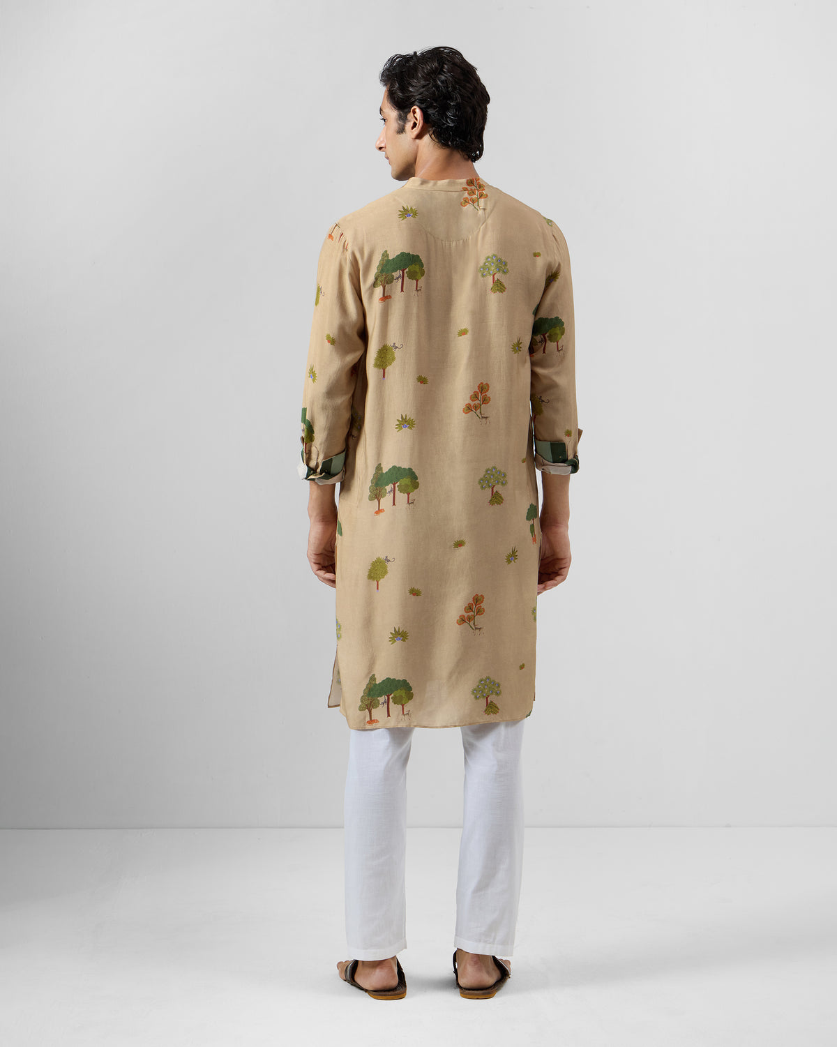 Back of a beige Bageecha kurta with a tree print.