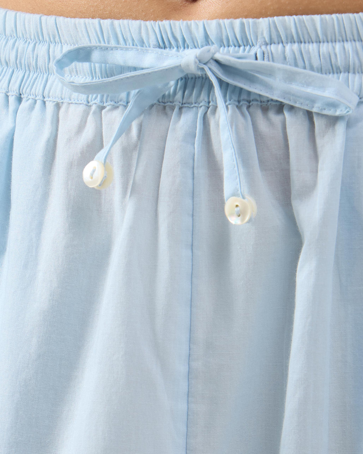 Close-up of the drawstring waistband on ice blue Narrow Pants.