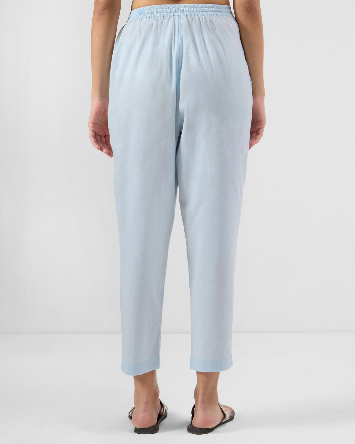 Back of ice blue Narrow Pants with a cropped tapered leg.