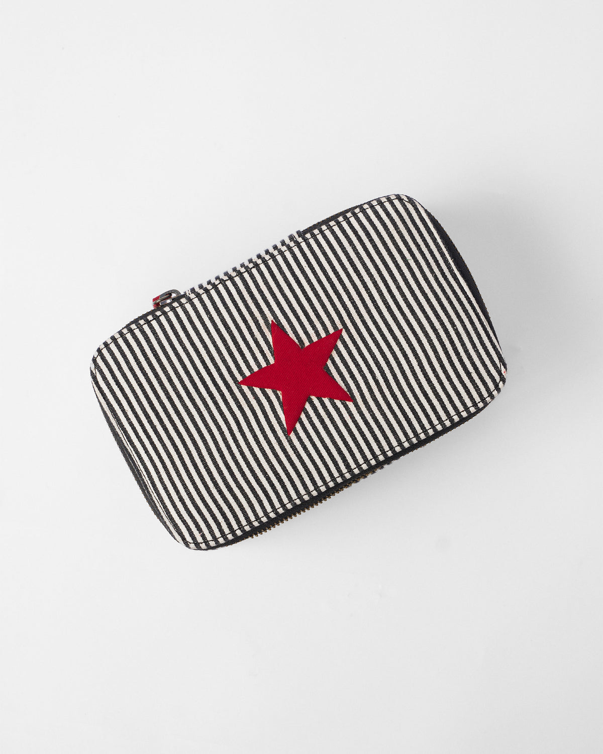 Black and white striped jewellery organiser showing a large red star.