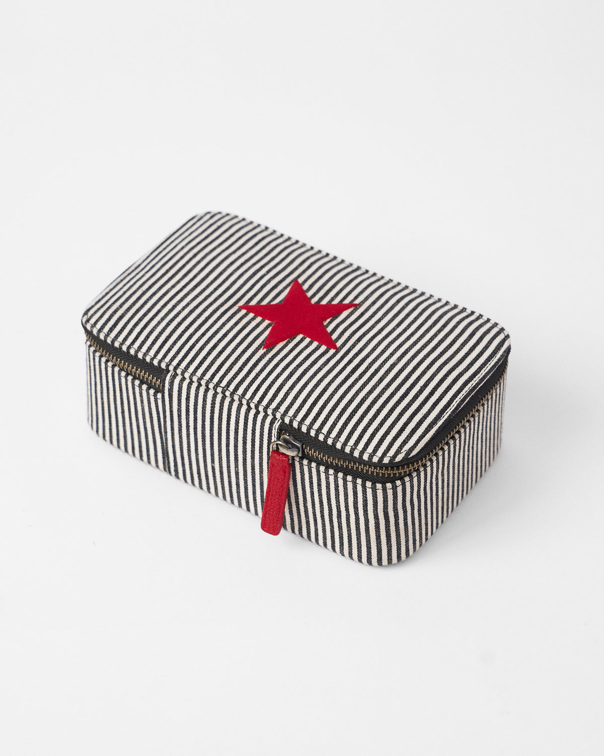Structured black and white striped Tara organiser with a red star and zipper pull.