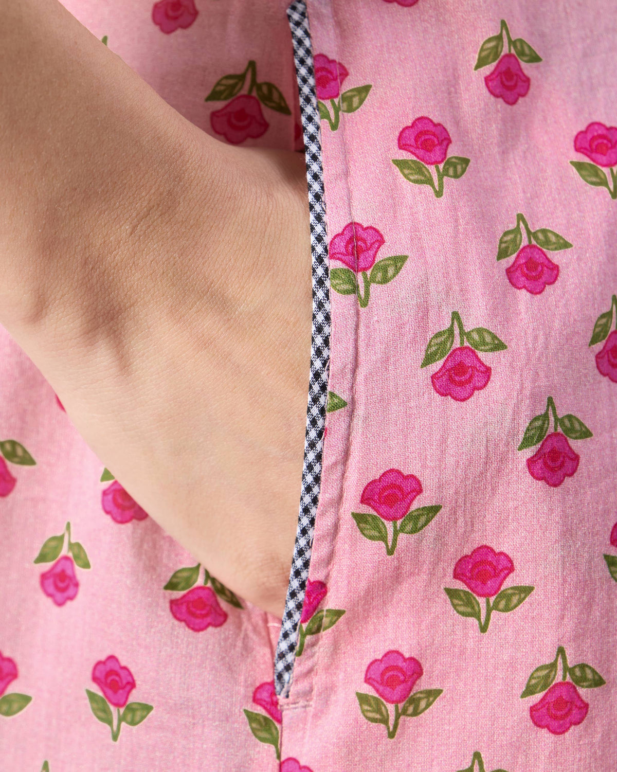 Close-up of a side pocket with check piping on a pink Summer Fun kurta.