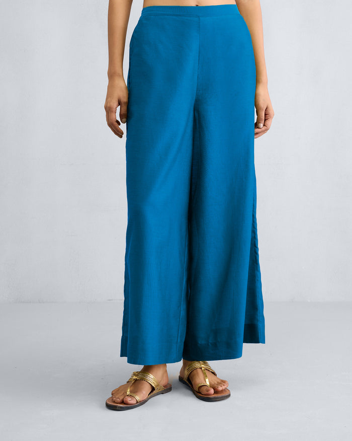 Person wearing sapphire Basic Pyjamas with wide legs.
