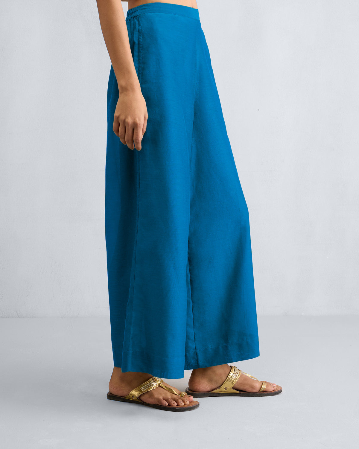 Side view of sapphire Basic Pyjamas with wide legs.