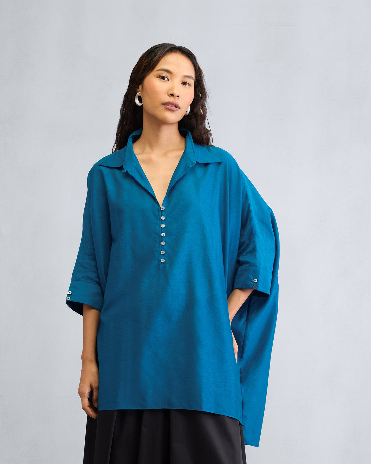 Sapphire Hala tunic with an oversized fit and a central white button placket.