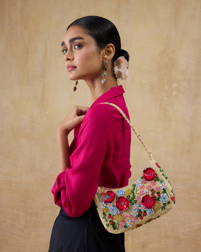 Floral embroidered Bloom Bag worn on the shoulder.
