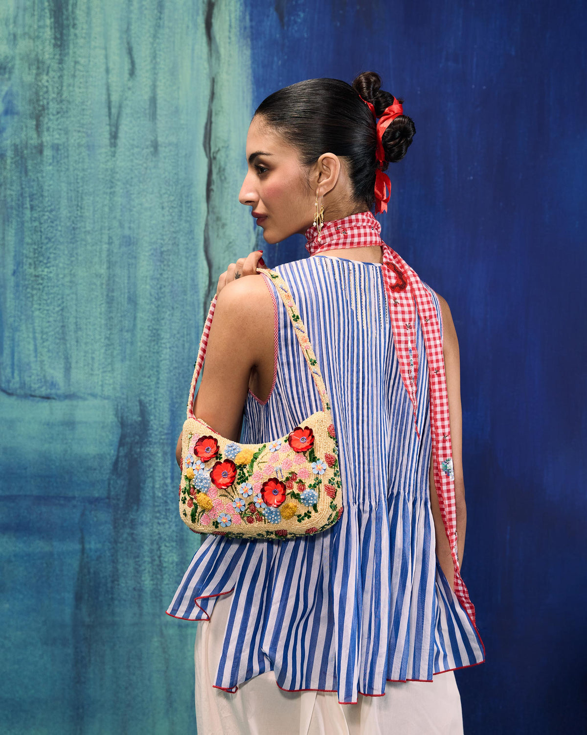 Floral embroidered Bloom Bag worn across the back.