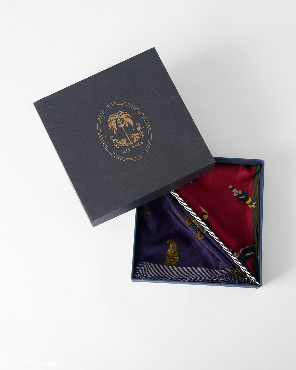 Leopard Pocket Squares in a navy Nicobar gift box.
