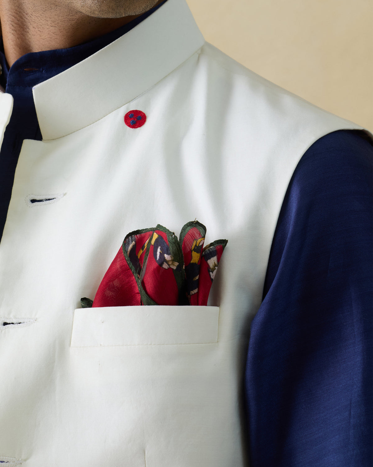 Crimson Leopard Pocket Square with hornbills worn in a jacket pocket.
