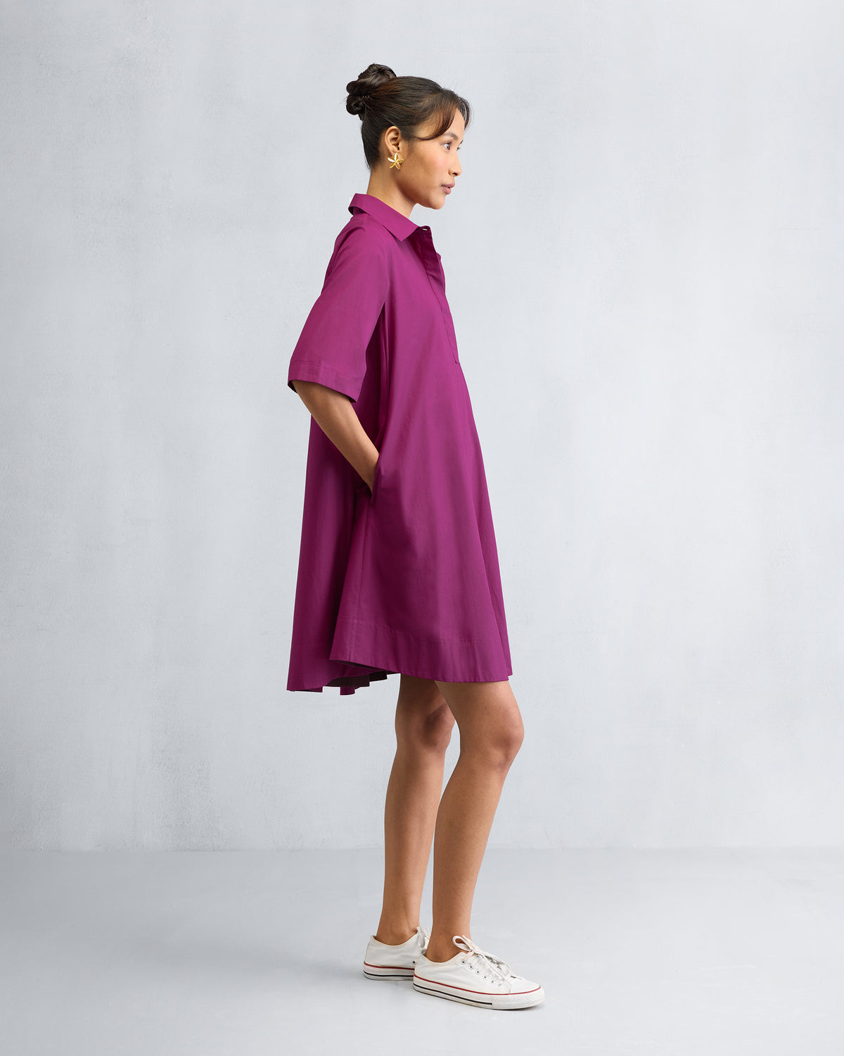 Side view of a mulberry A-line Short Dress with a flared mini hem.