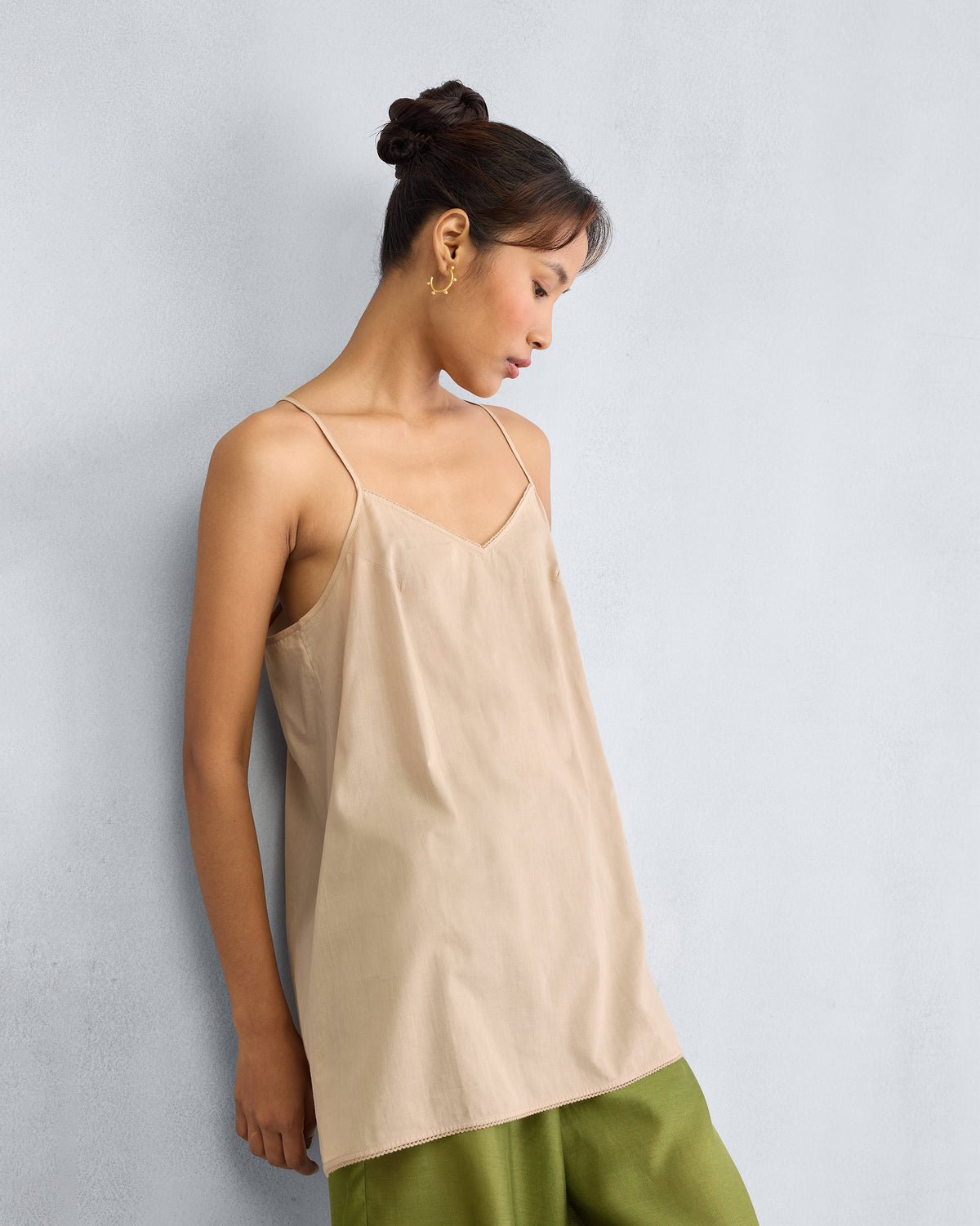 Sand Afra Camisole with a V-neck worn at a three-quarter angle.