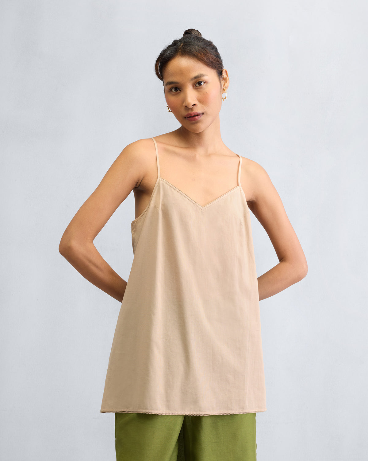 Sand Afra Camisole with spaghetti straps worn hip length.