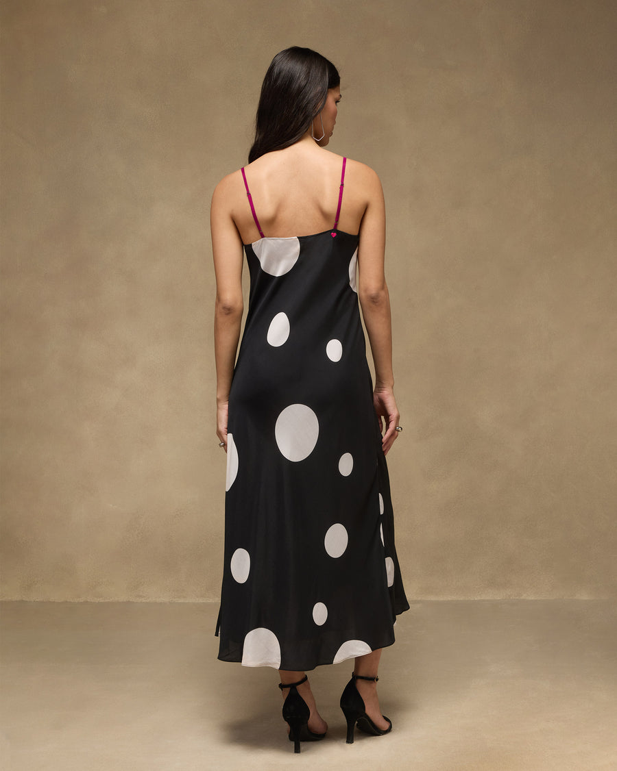 Back view of the Afterhours Dress, the low back held by slim fuchsia straps.