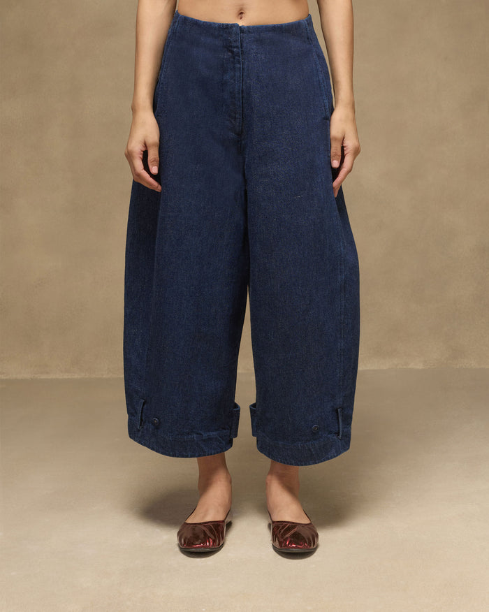 Navy Groove Pants in a relaxed wide-leg denim fit with button-tab cuffs.