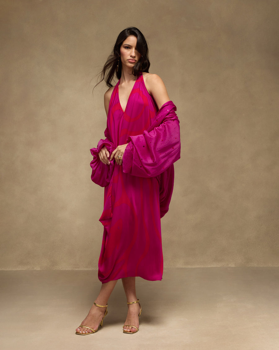 The fuchsia Cloud Overlay slipped off the shoulders over the pink Shaker Halter Dress.