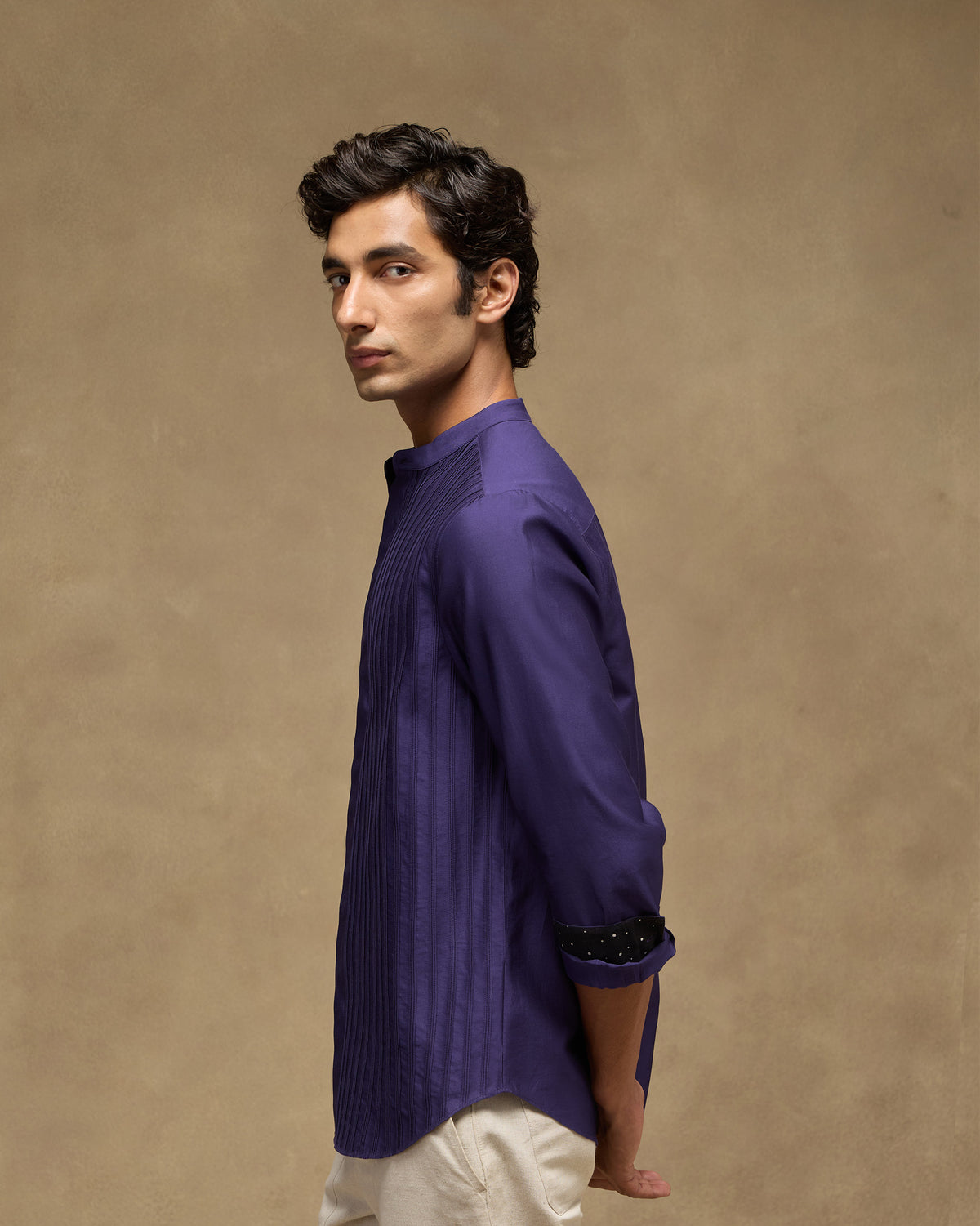 Sundown Shirt side profile in deep purple with rolled sleeves and dotted lining.