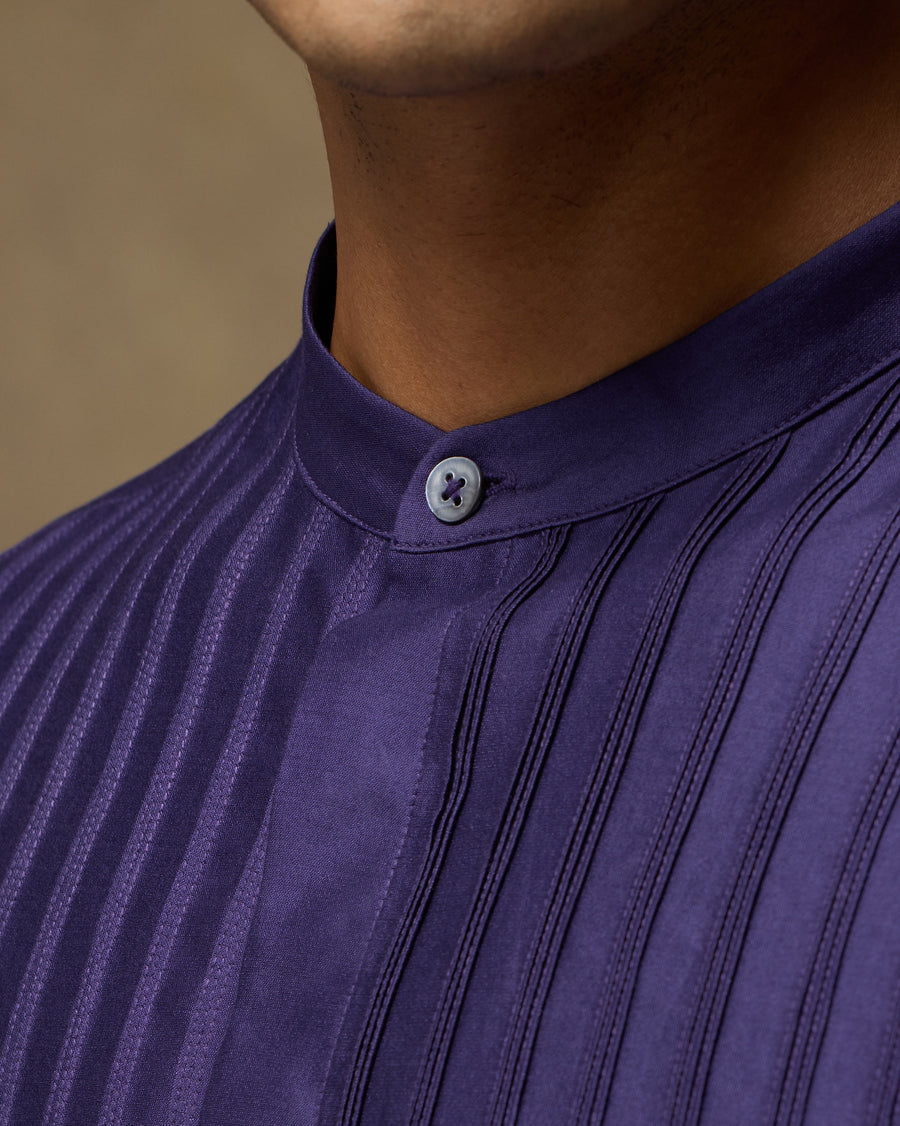 Close-up of the band collar and fine pintucks on the front of the Sundown Shirt.