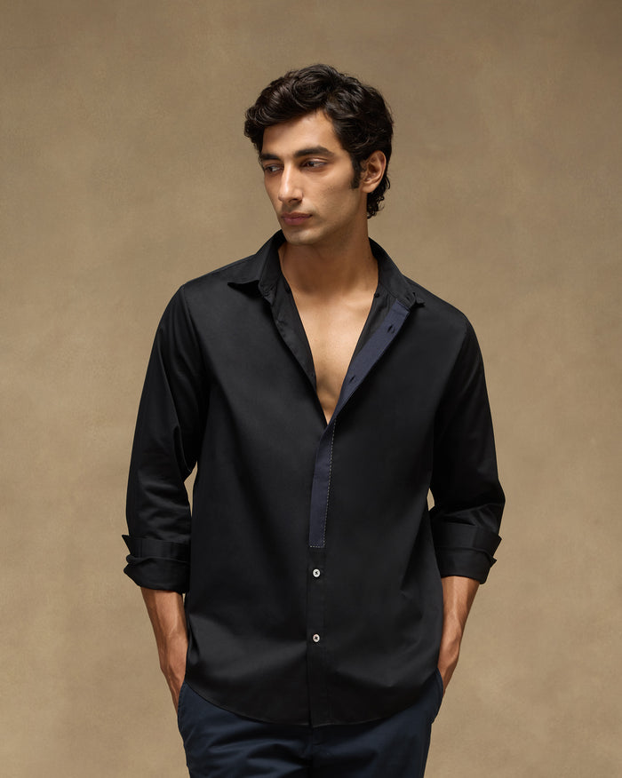 Person wearing a black Midnight Shirt.