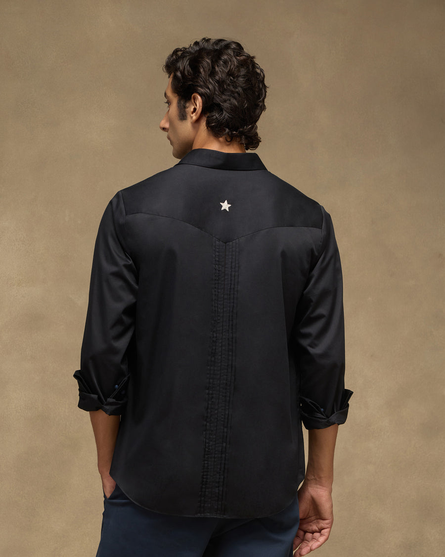 Back view of the Midnight Shirt, with a V-shaped yoke and fine pintucks running down the centre.