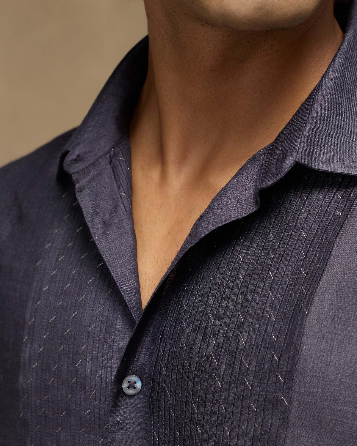 Close-up of a light purple Afterglow shirt showing pintucks and zari dashes.