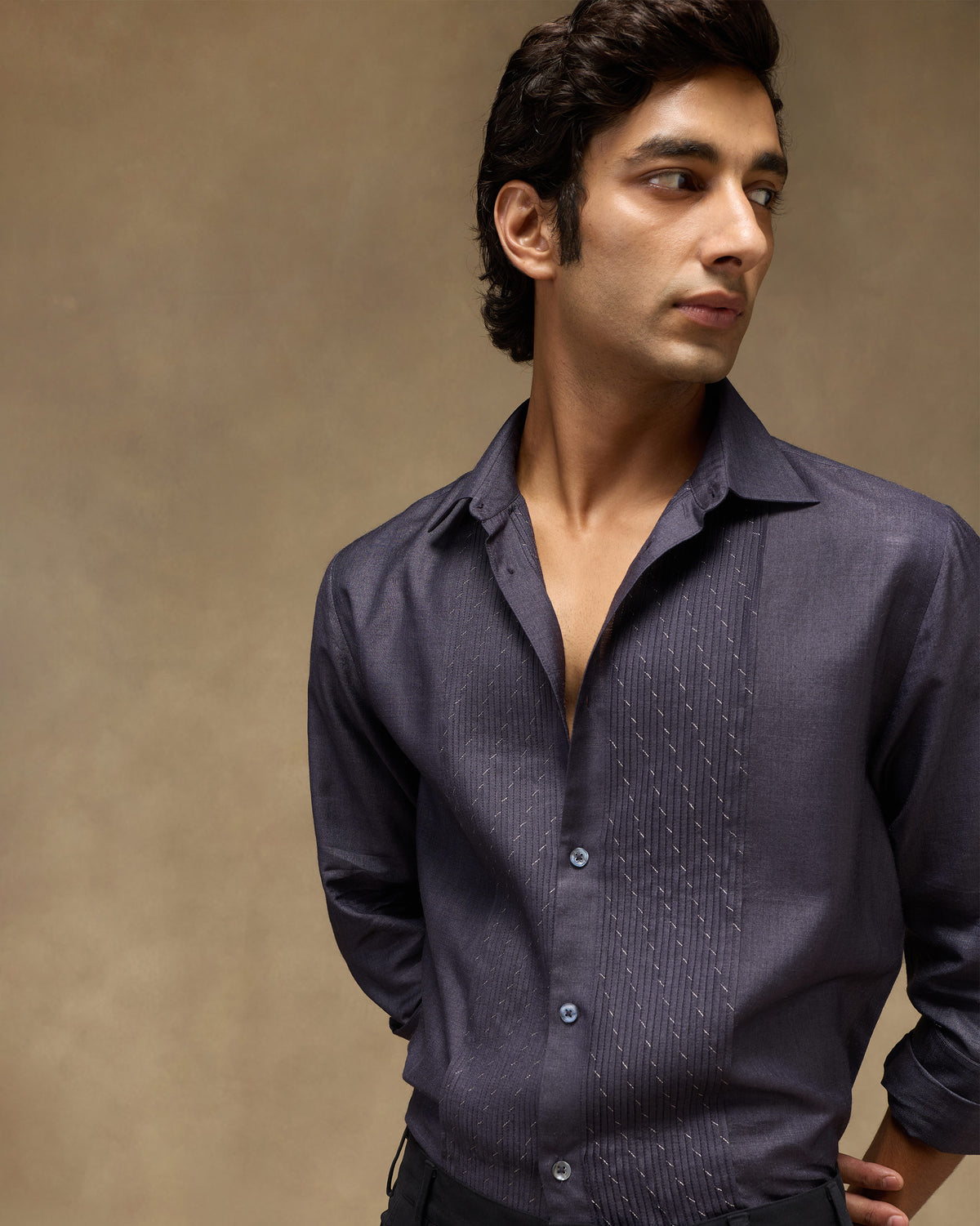 Person wearing a light purple Afterglow shirt with embroidered pintuck panels.