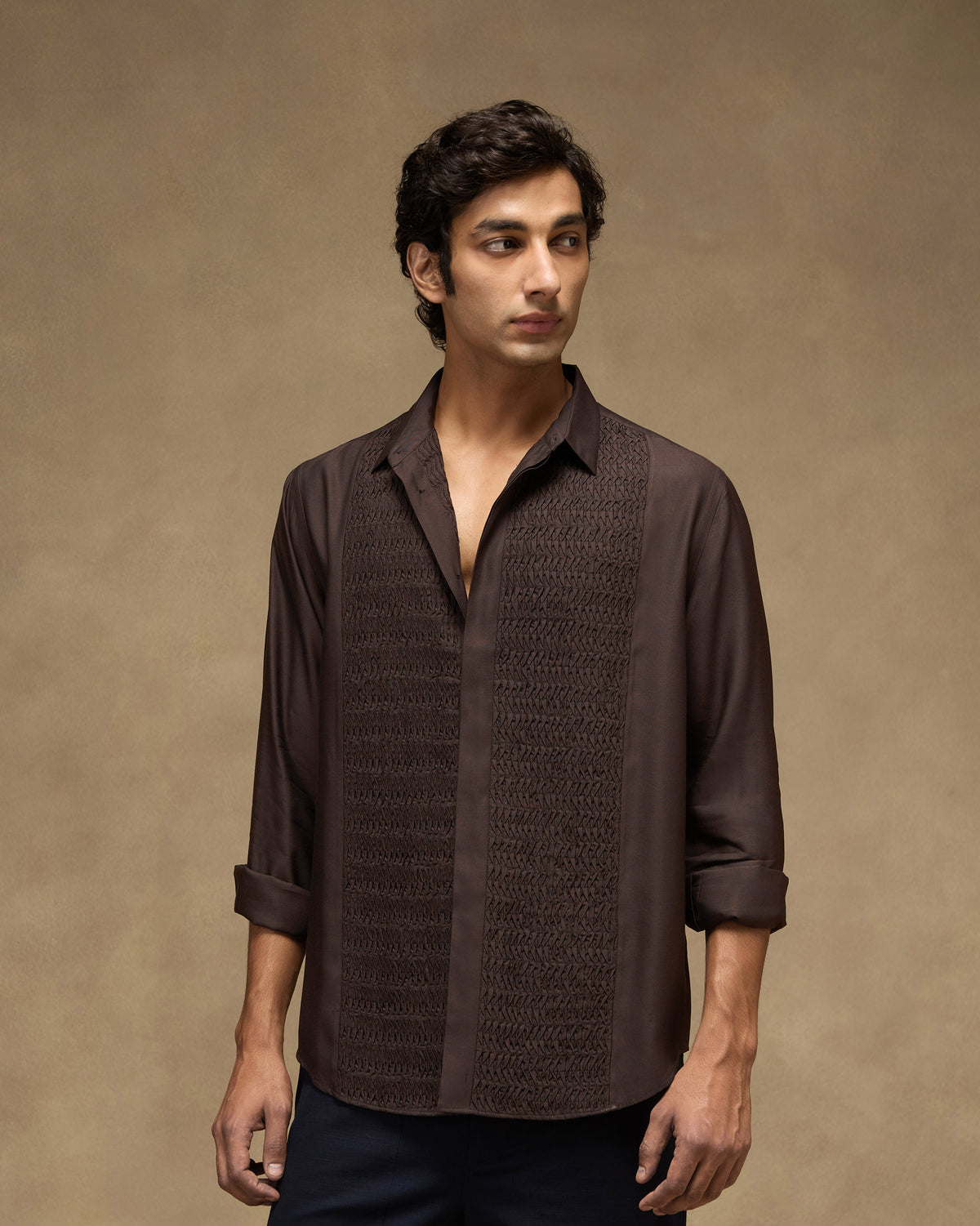 Person wearing a deep brown Afterhours shirt with pintuck front panels.