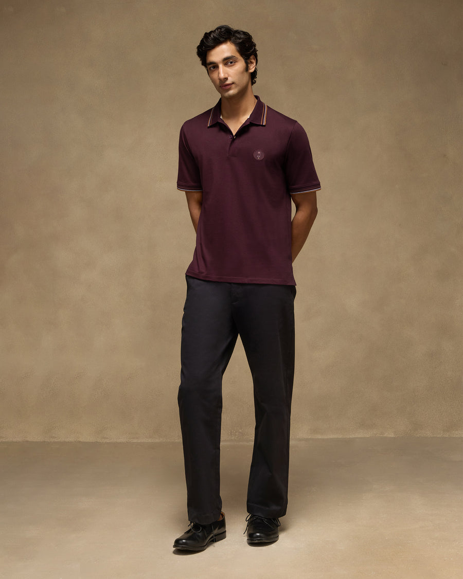 The Stag Polo T-Shirt over the black Panther Trousers, with black lace-ups.