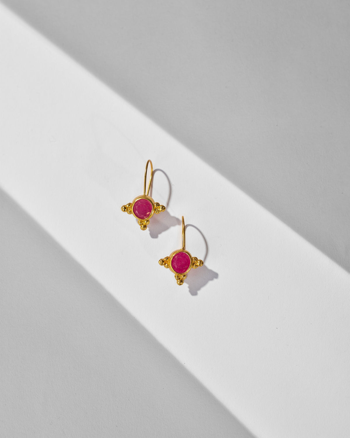 Pair of gold Pink Jade Drops with round pink stones.