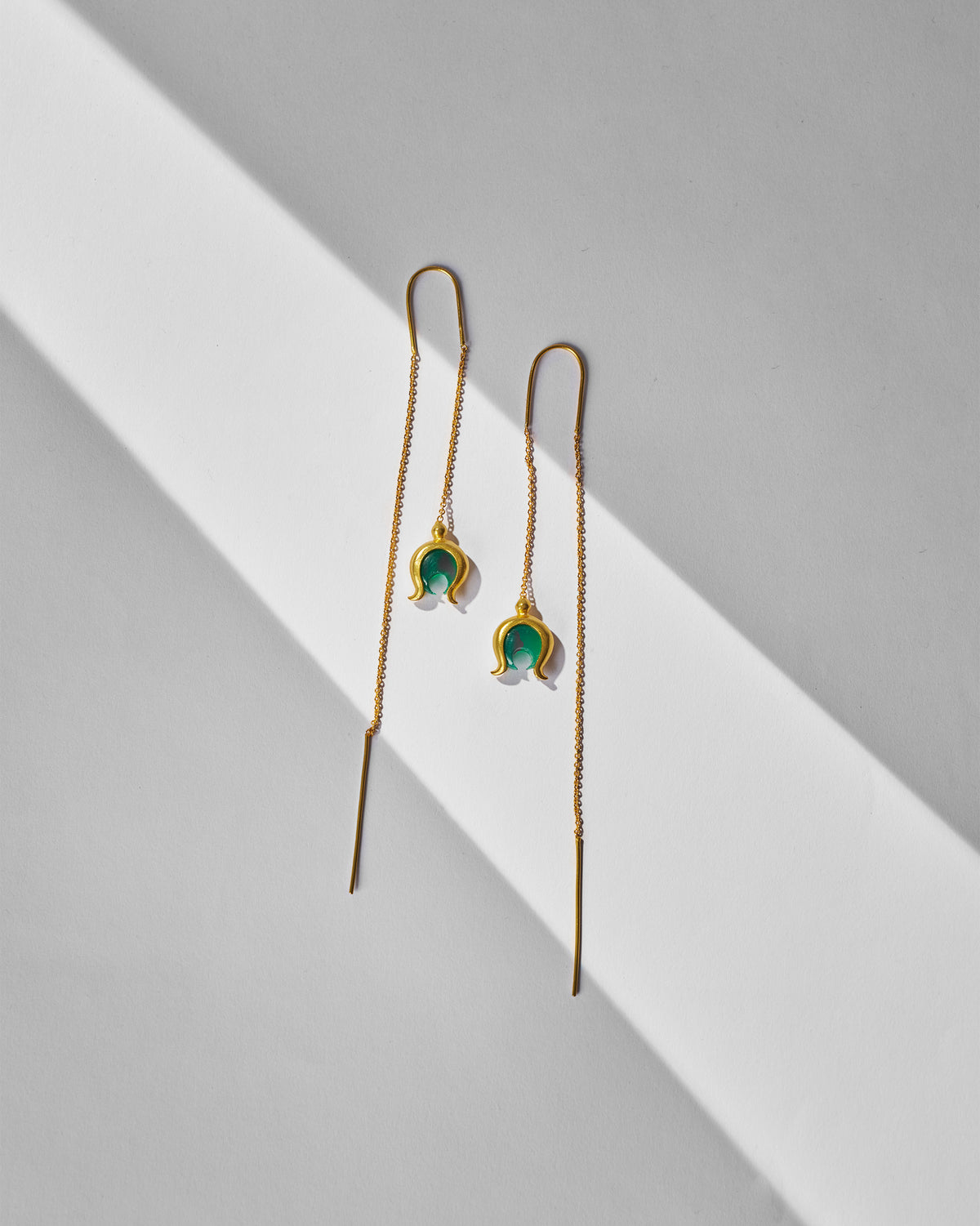 Pair of gold Chandphool sui dhaga earrings with green onyx crescent drops.