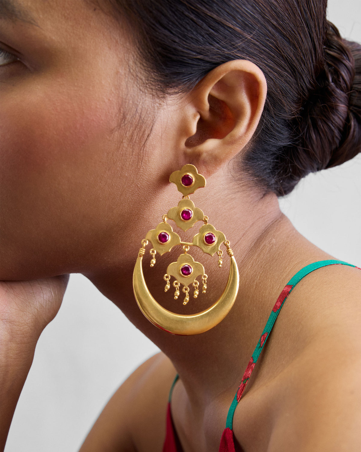 Side profile of a gold Moon Flower chandelier earring.